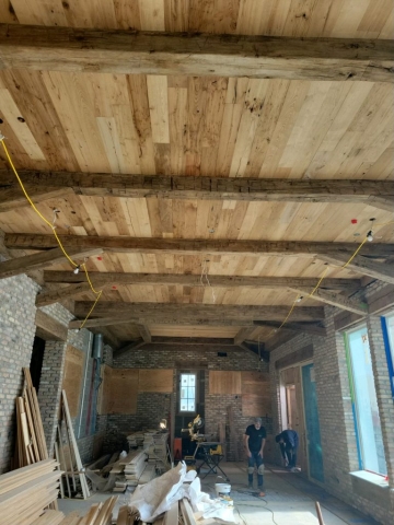 Smooth Face Antique Reclaimed Wormy Chestnut Ceiling Planking with Antique Reclaimed Hand Hewn Box Beams
