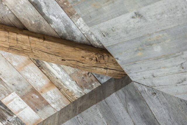 Weathered Grey and Faded White Barnsiding Ceiling Planking and Hand Hewn Box Beam