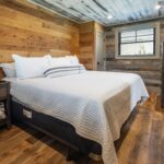 Reclaimed Wormy Chestnut Wall Paneling, Original Face Reclaimed Skip Planed Oak Flooring and Reclaimed Weathered Grey Barnsiding